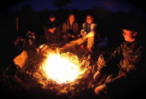 Group of people around a campfire